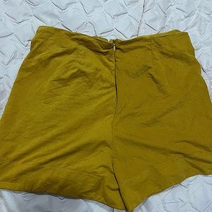these are some yellow shorts that aren’t so so so stretchy. zipper on back.